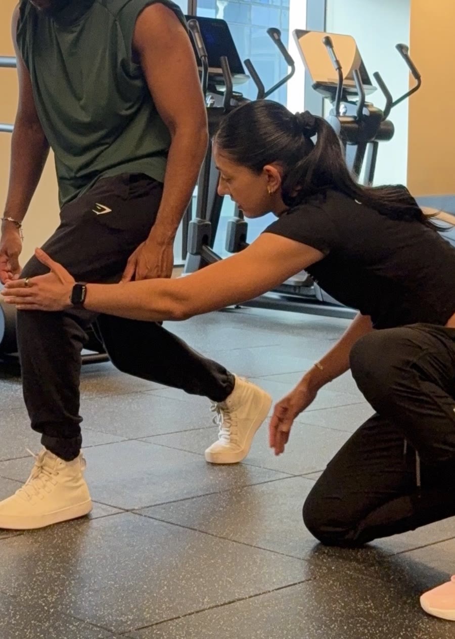 Amrit Kaur assessing a client's split squat position